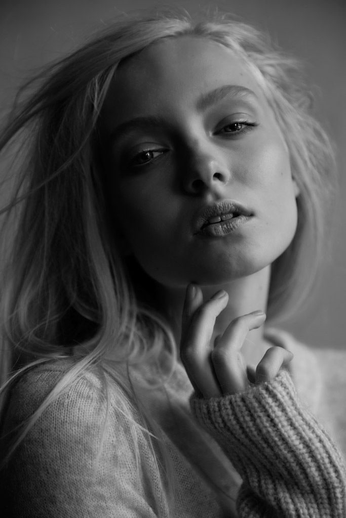 Nikita Lauffer, close black and white portrait, one hand at her chin