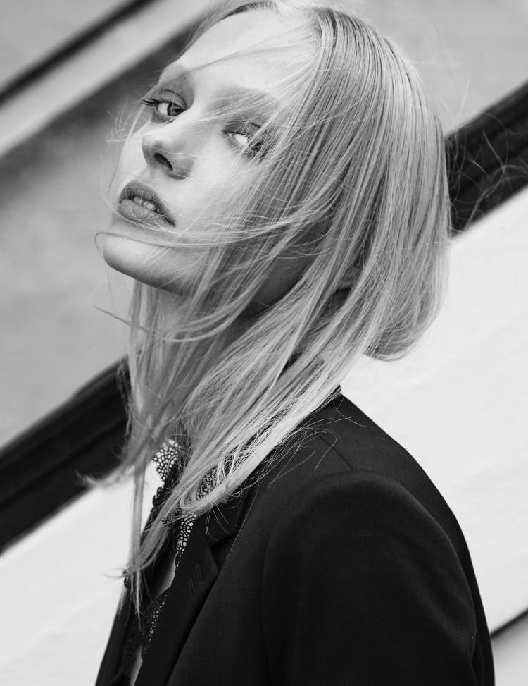Close portrait with wind-blown hair, black and white